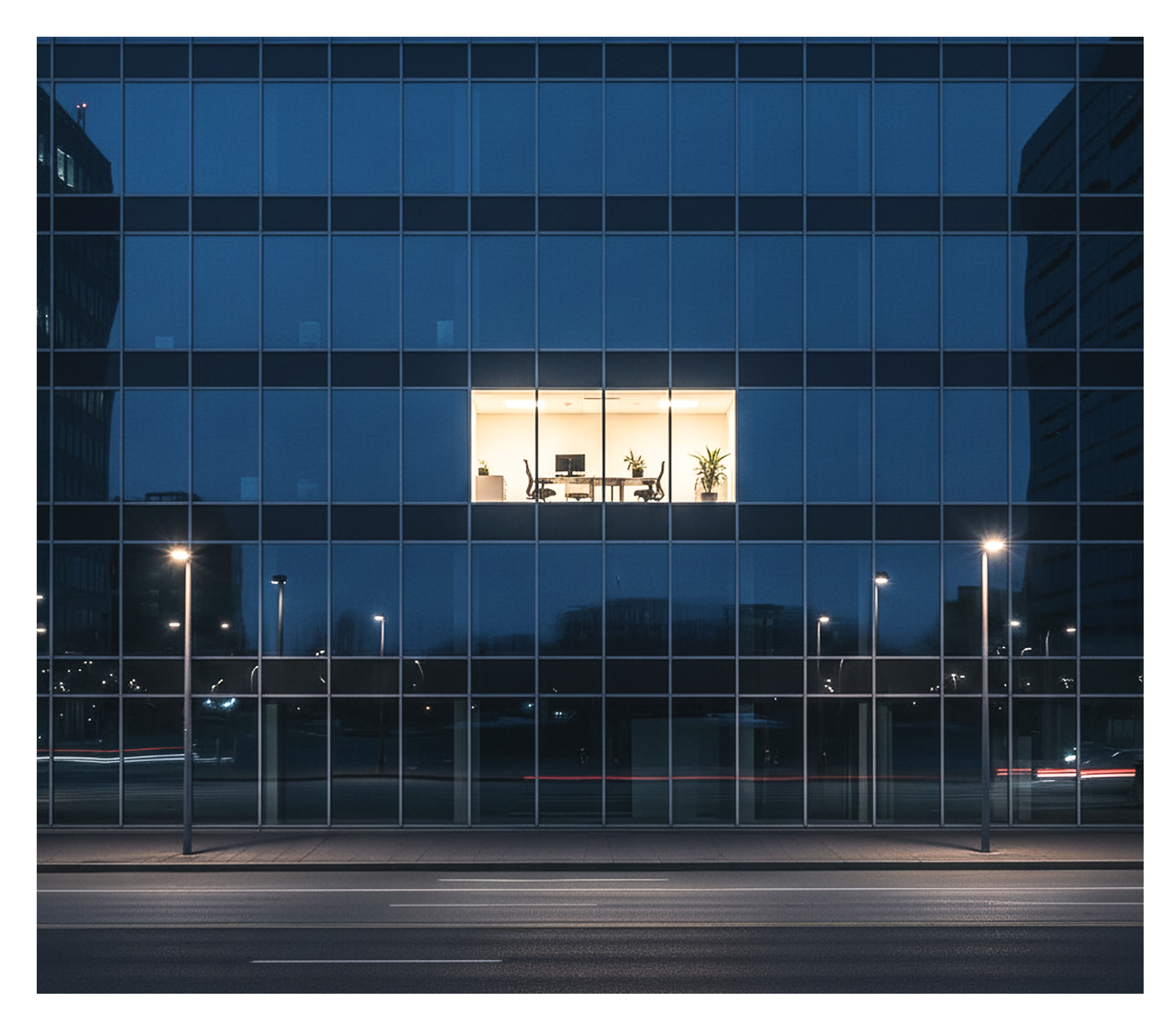 Energy Waste depicts a building with a light on and no one inside